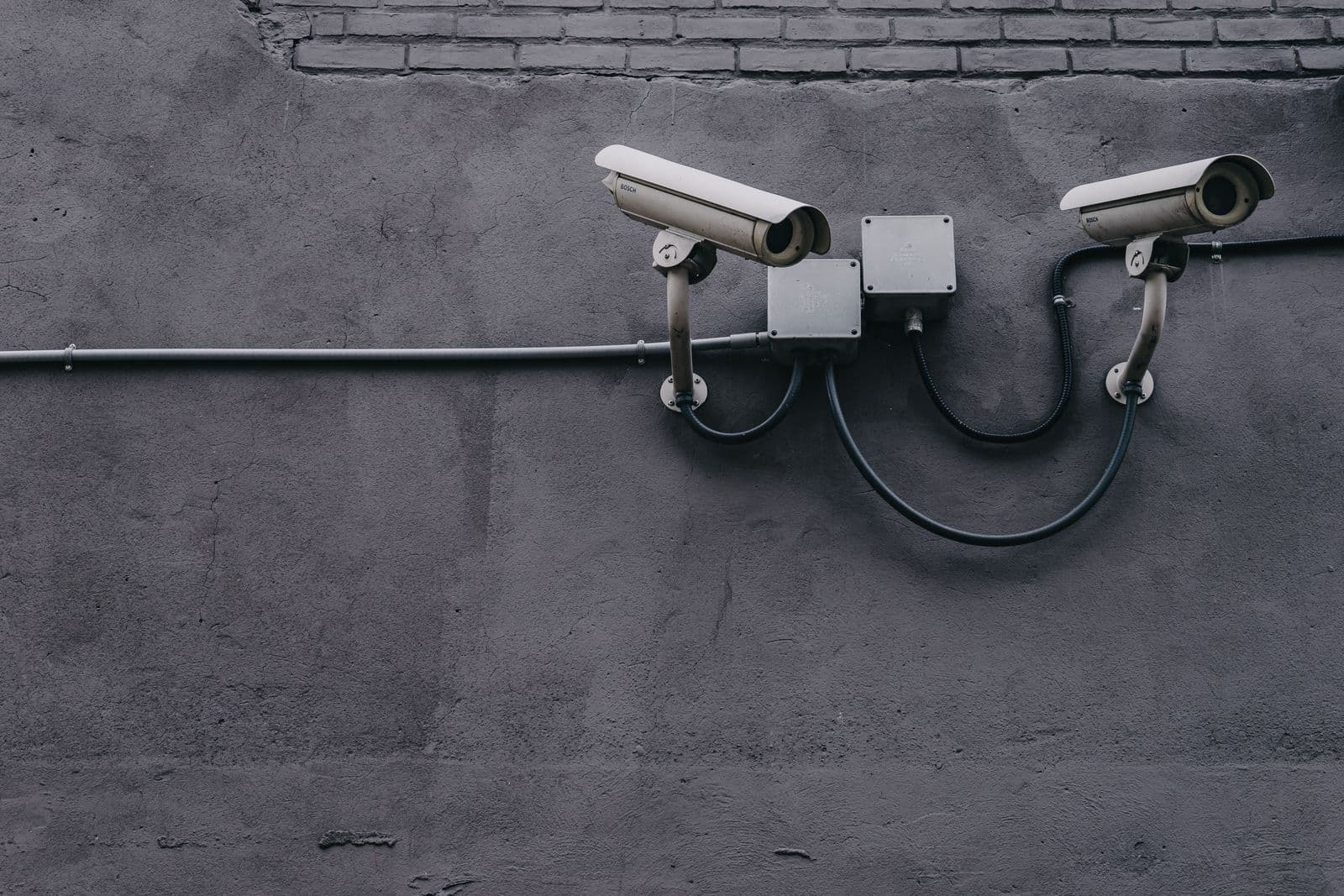 Security cameras mounted on a commercial building wall